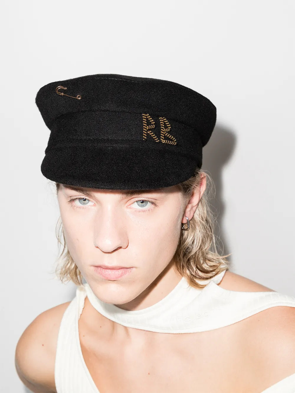 Baker boy cap with safety pin