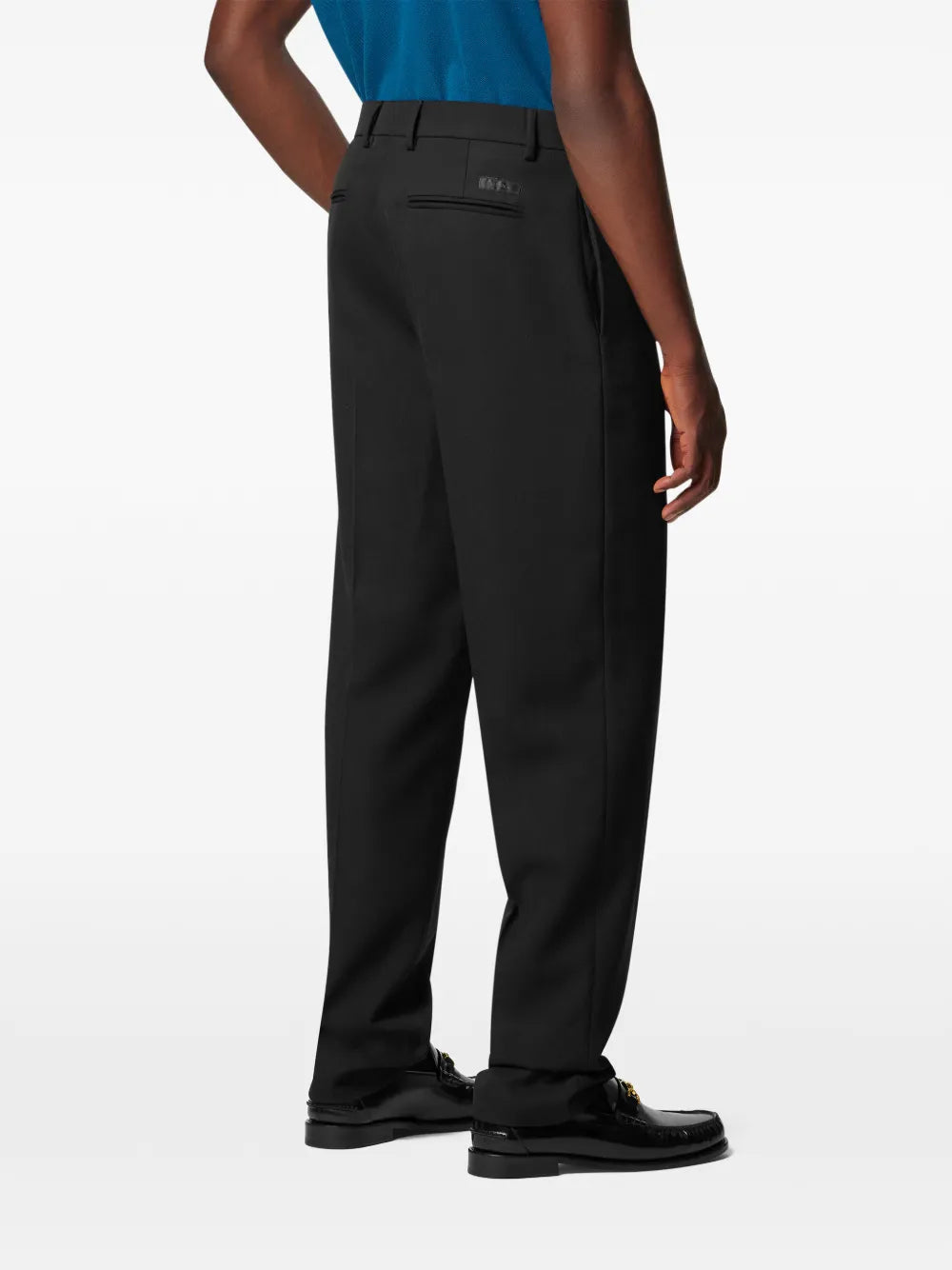 Pants with Medusa buttons